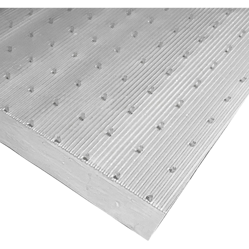 Corner of clear low pile carpet floor runner with the grippers showing
