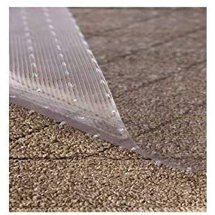 Corner of clear low pile carpet floor runner with the grippers showing on carpet