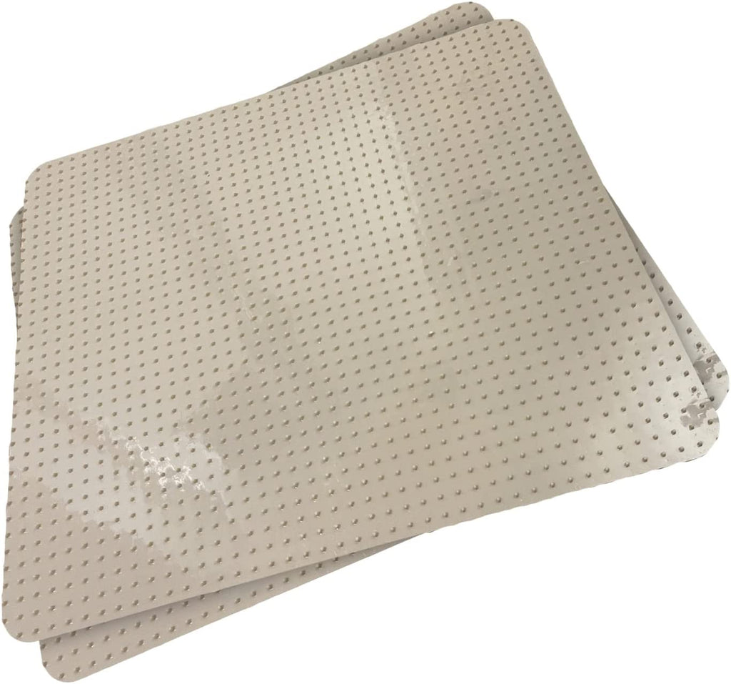 Tan pet deterrent tiles upside down with prongs facing up