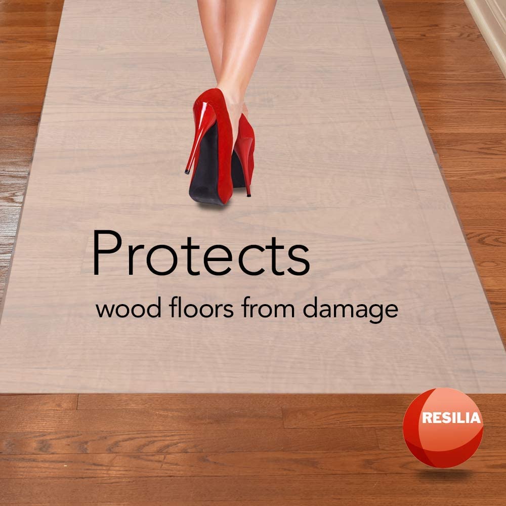 Woman with red heels walking on runner while wood floors are being protected from damage