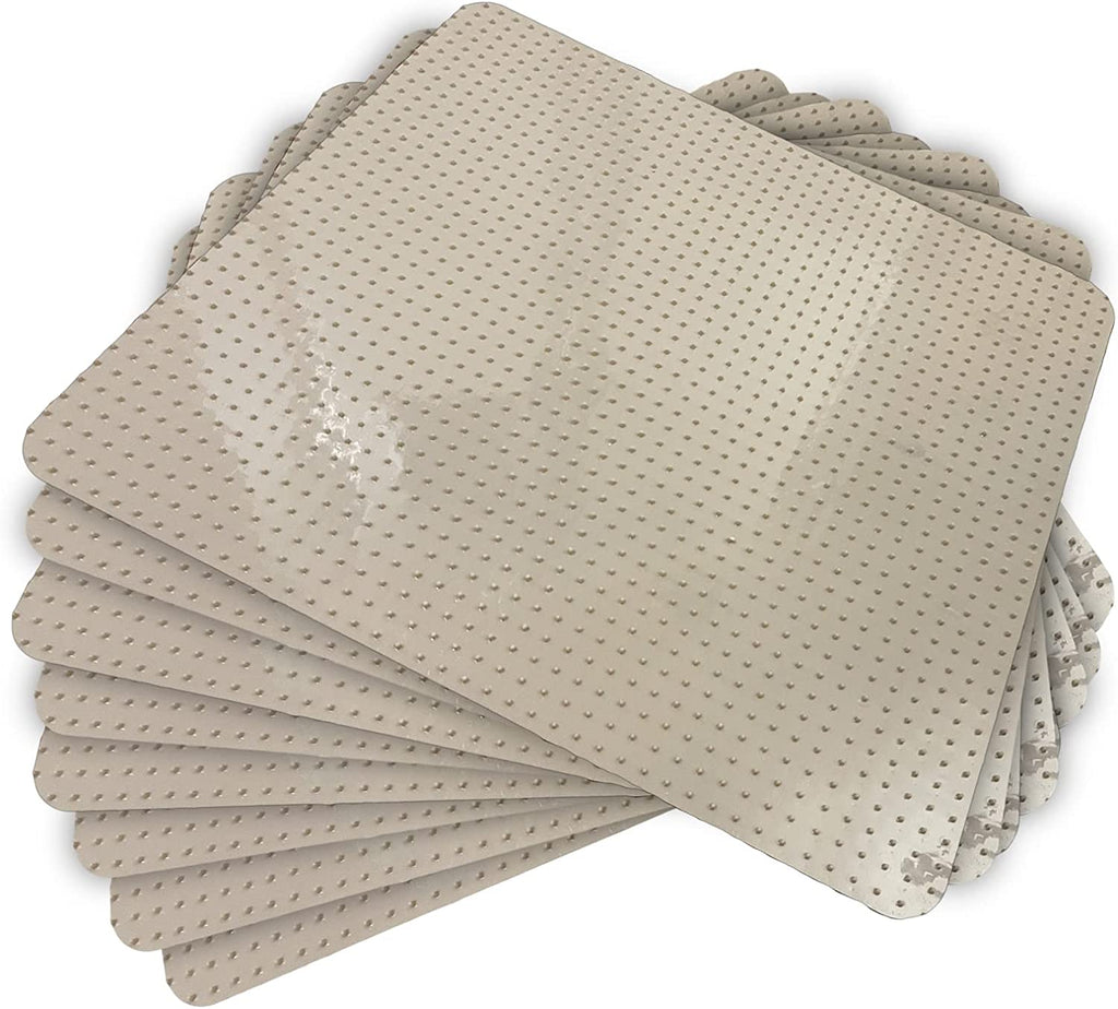 Stack of 4 tan vinyl tiles with plastic spikes