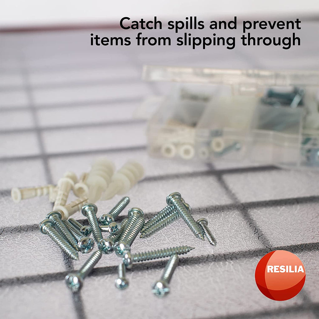 Shelf liner with screws and nails on top to catch spills and prevent items from slipping through