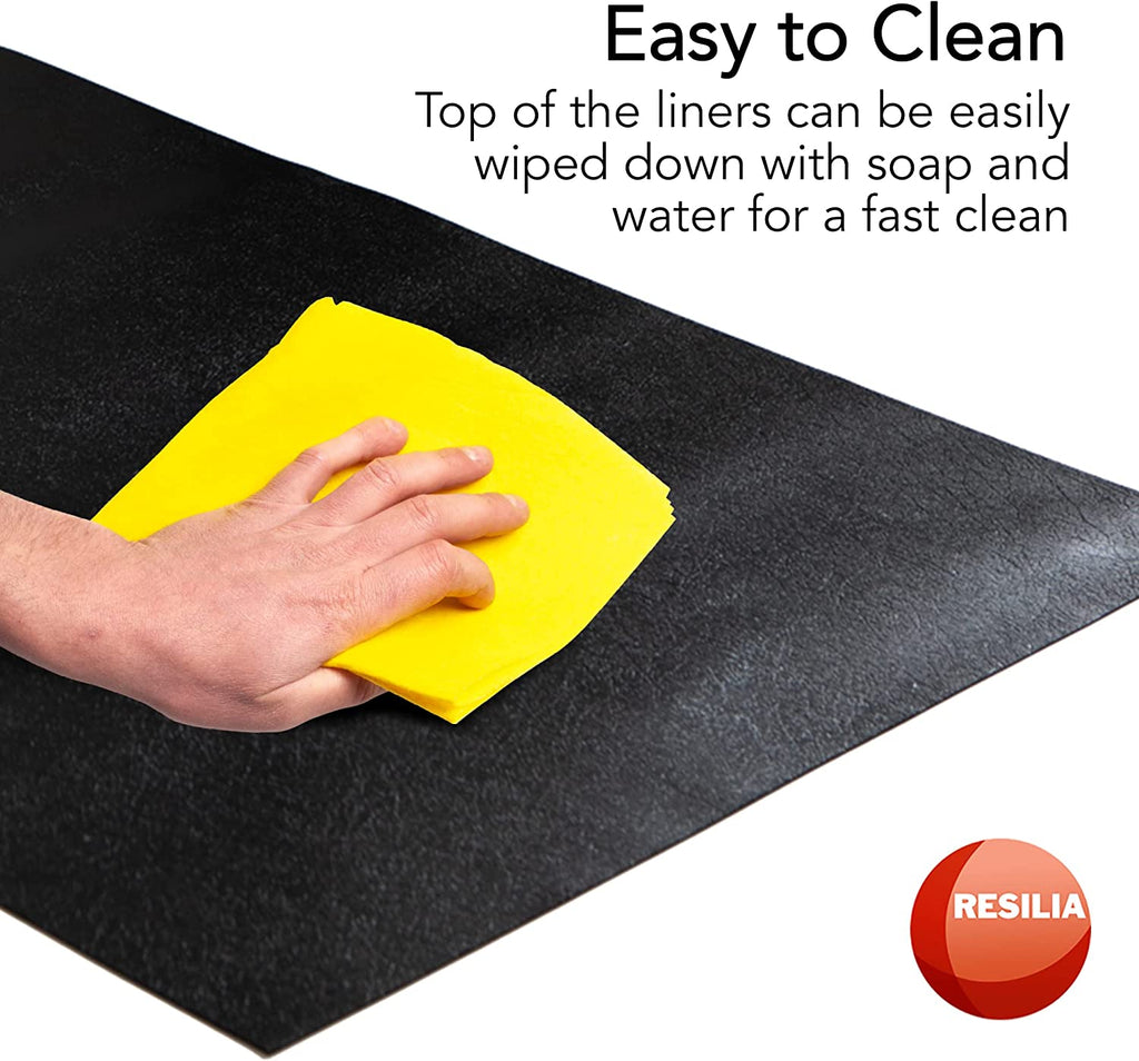 Hand with yellow cloth easily cleaning the black shelf liner. Top of the liners can be easily wiped down with soap and water for a fast clean