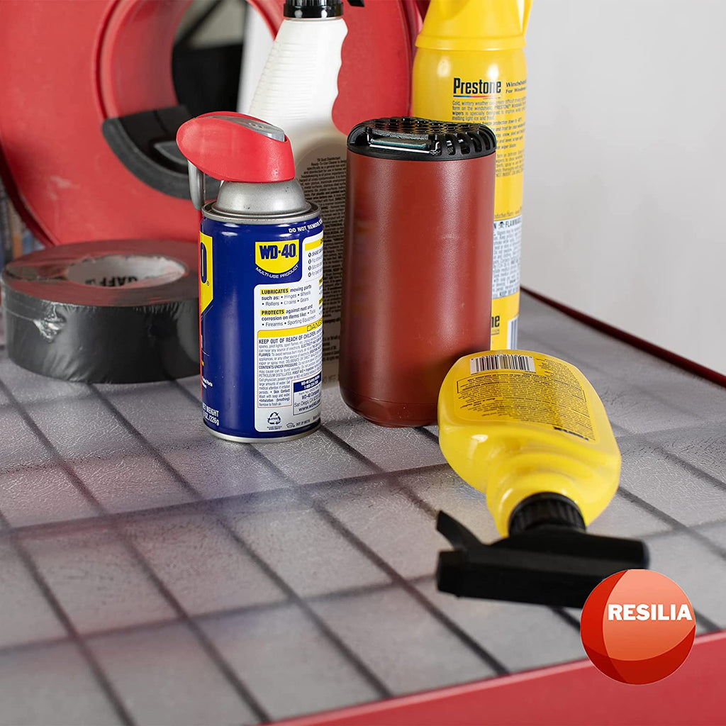 Red shelves with clear liner and garage cleaning supplies on top