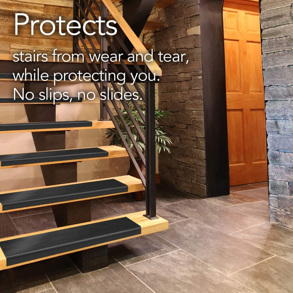 Black stair treads protecting wooden stairs from wear and tear, while protecting you. No slips, no slides