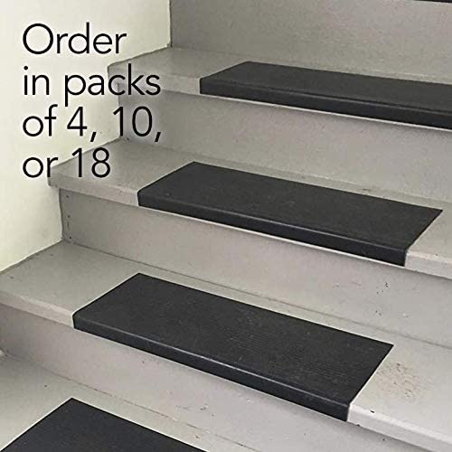 Black stair treads on gray stairs. Order in packs of 4, 10 or 18