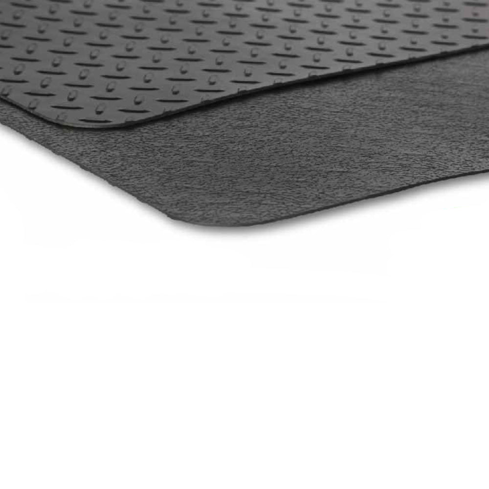 Grill mat folded in half to show diamond plate top and textured bottom