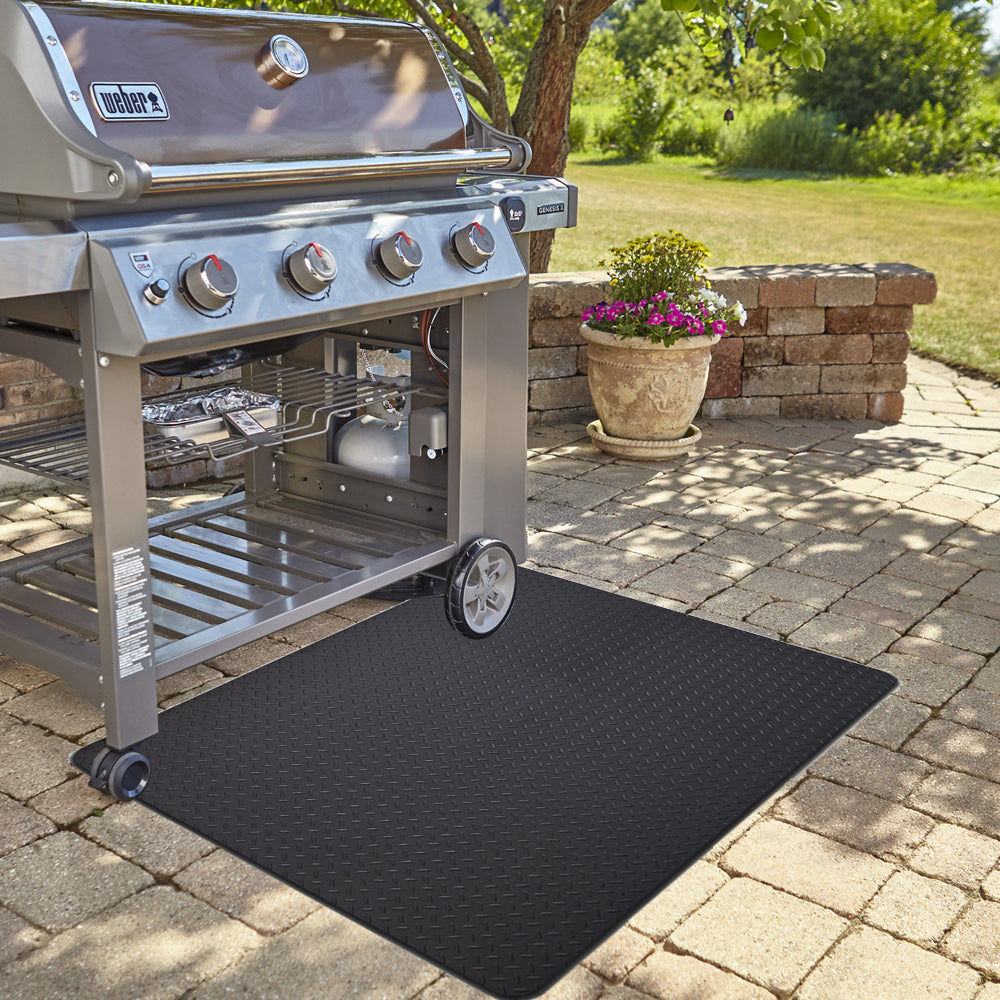 Grill mat on patio under grill