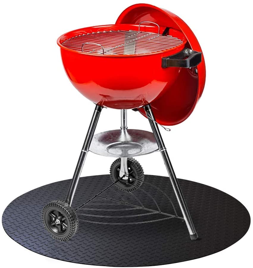 Smaller red charcoal grill on top of black grill mat with diamond plate