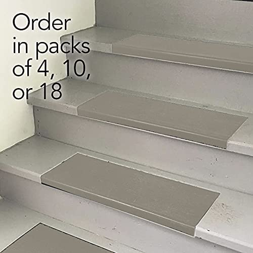 Sandstone stair treads on gray stairs. Order in packs of 4, 10 or 18