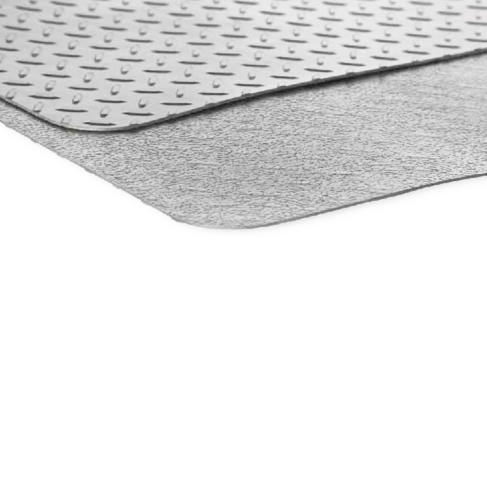 Grill mat folded in half to show diamond plate top and textured bottom